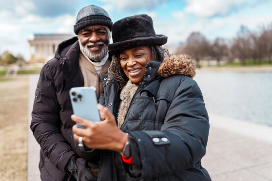 couple smiling at phone