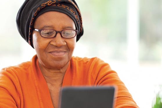 A woman looking at a tablet